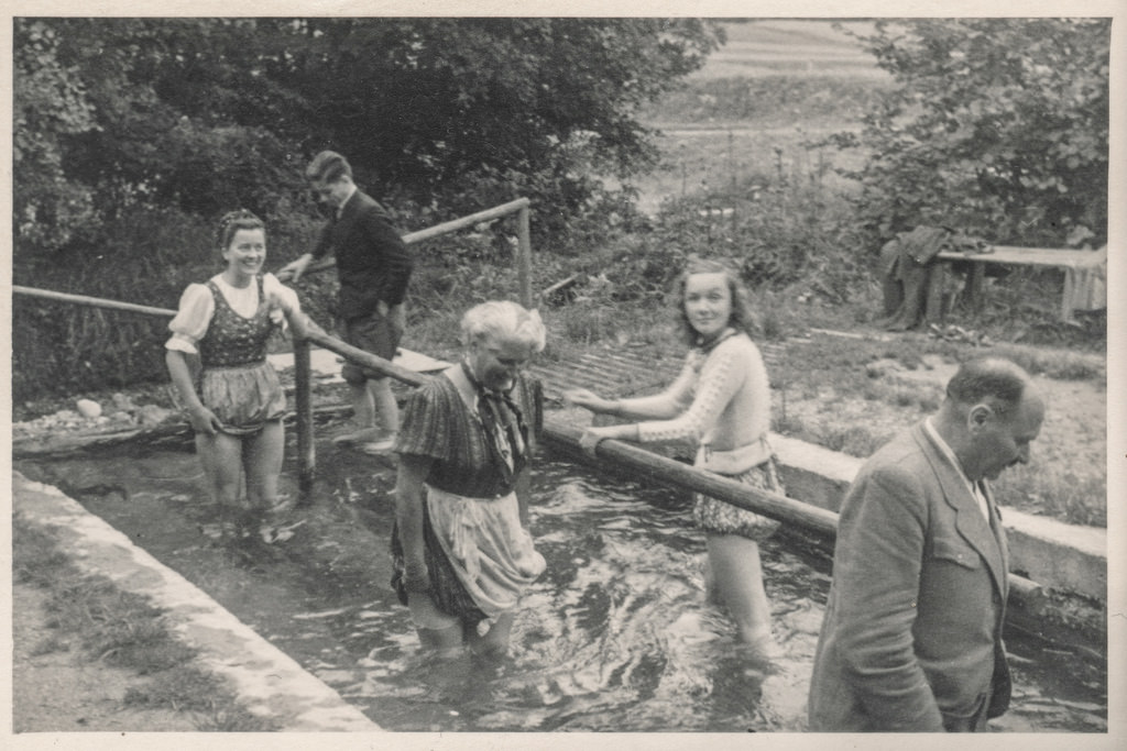 People walking in a Kneipp pool