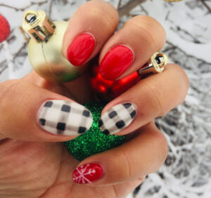 Buffalo Plaid, snowflake, and festive red manicure with CND Shellac.